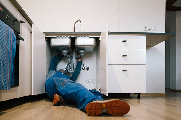 Professional Emergency Plumber technician working in Woodburn, IN